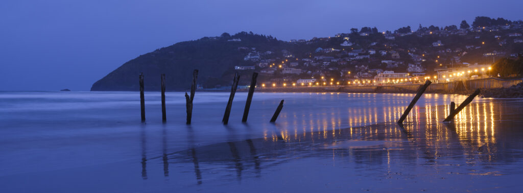 New Zealand, Dunedin, St Clair Beach. The blue tones of pre-dawn at St Clair, a popular seaside resort in Dunedin, Otago.