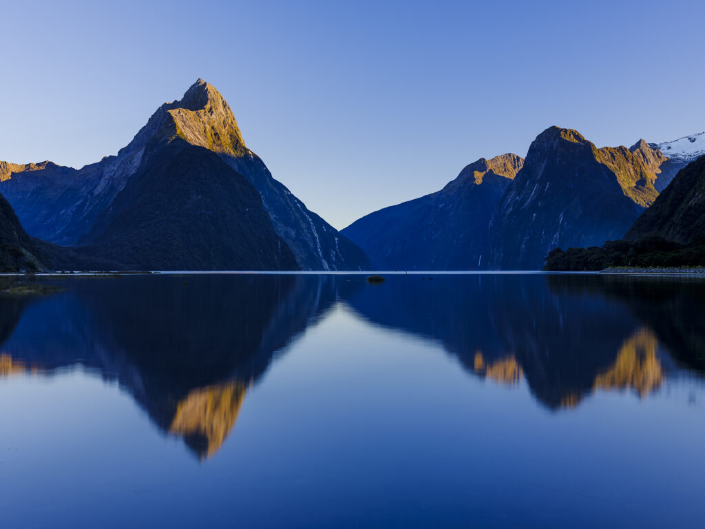 New Zealand, South Island, Fiordland National Park. A calm morning at the Milford Sound in Fiordland National Park.