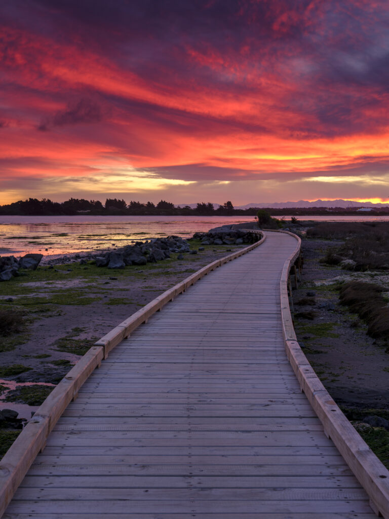 New Zealand, Christchurch, New South Brighton. A colourful sunset above the Avon Heathcote Estuary in Christchurch.