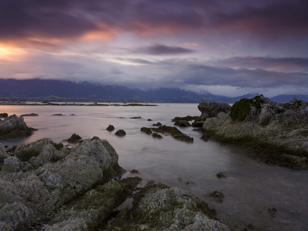 New Zealand, South Island, Kaikoura. Sunset at the Kaikoura Peninsula viewed from Point Kean.