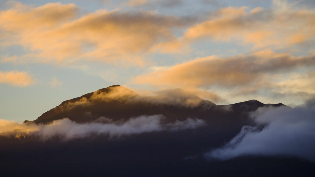 New Zealand, South Island, Fiordland National Park. Last light on the mountain peaks of the Fiordland National Park, viewed from the shores of Lake Te Anau.