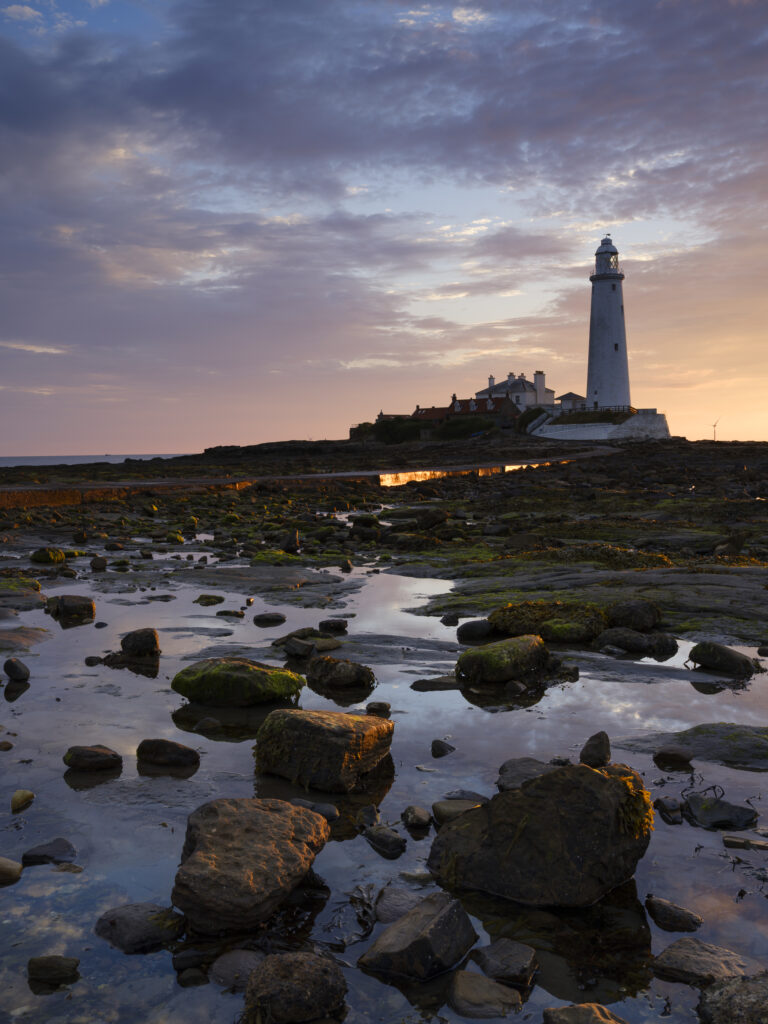 England, Tyne and Wear, Whitley Bay. St Mary's Lighthouse and Island photographed at dawn.