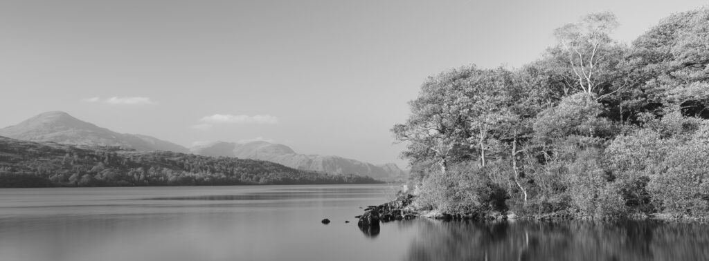 England, Cumbria, Lake District National Park. Coniston Water on a calm, autumn day.