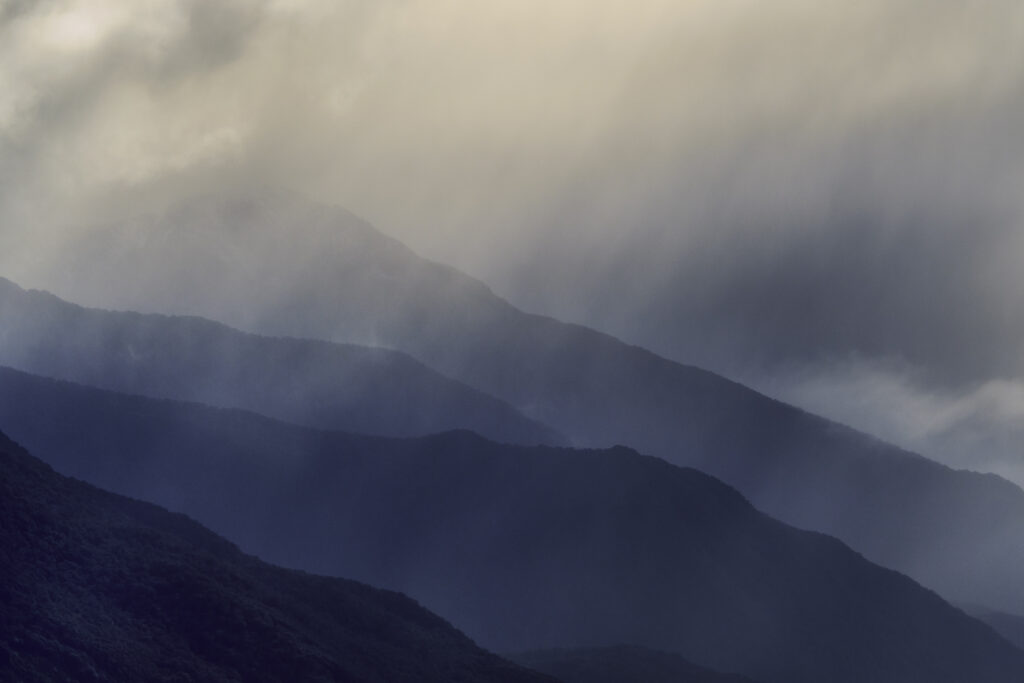 New Zealand, South Island, Mount Aspiring National Park. Dramtic light over the mountain peaks of the Mount Aspiring National Park in Otago.