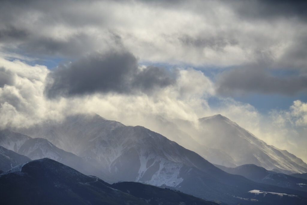 New Zealand, South Island, Kaikoura. Dramatic light as a storm clears over the Seaward Kaikoura Mountain Ranges.