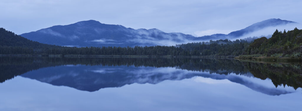 New Zealand, West Coast, Lake Paringa. Dusk at Lake Paringa in the Te Wāhipounamu South West New Zealand World Heritage Area.