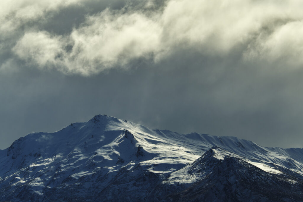New Zealand, South Island, Mount Aspiring National Park. Dramtic light over the mountain peaks of the Mount Aspiring National Park in Otago.