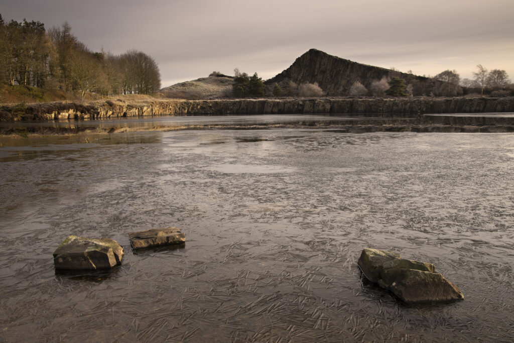 England, Northumberland, Hadrian's Wall. A frosty winters morning at Cawfields Quarry along Hadrians Wall, a world heritage site located within the Northumberland National Park.