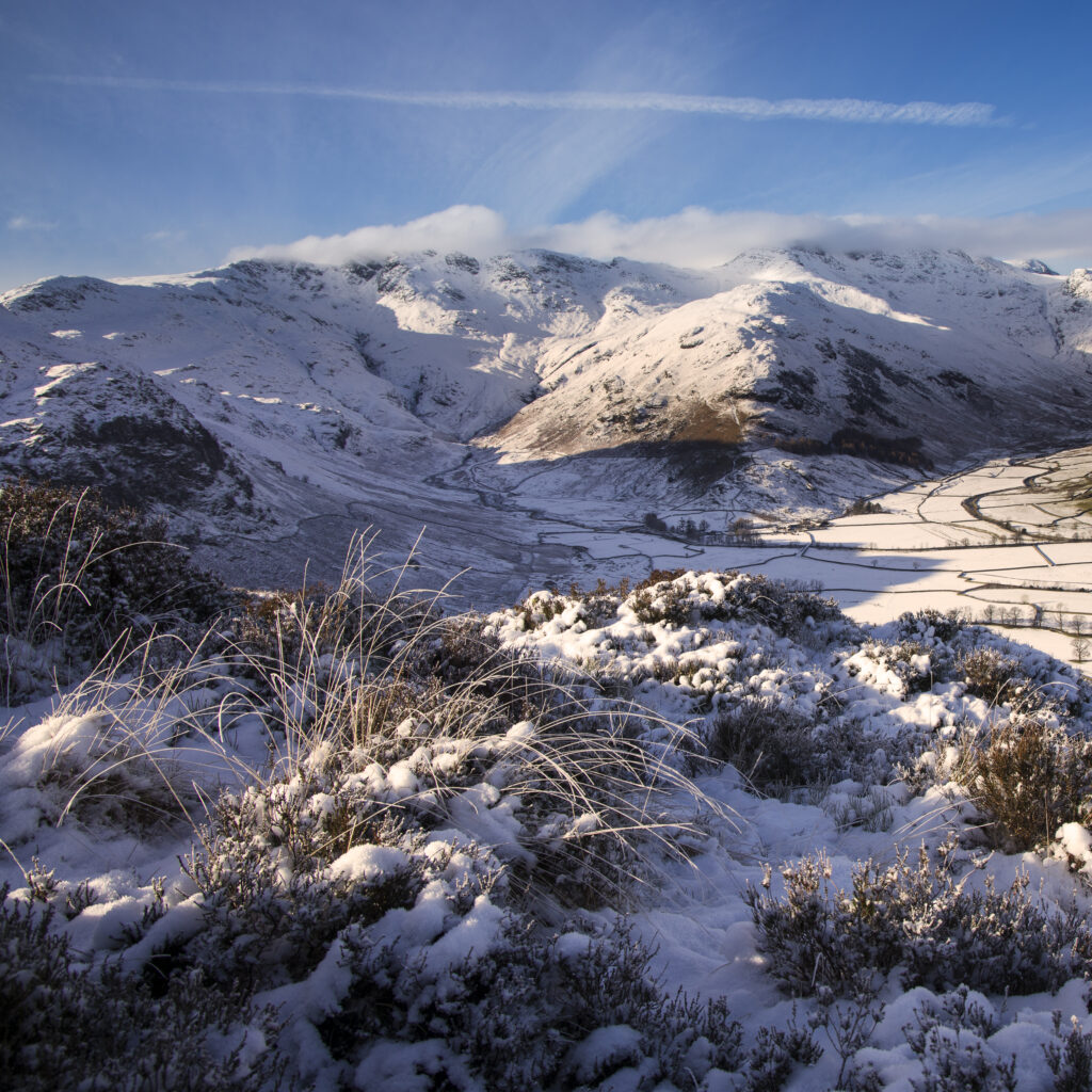 England, Cumbria, Lake District National Park. A snow covered Great Langdale Valley photographed on a mid winter day.