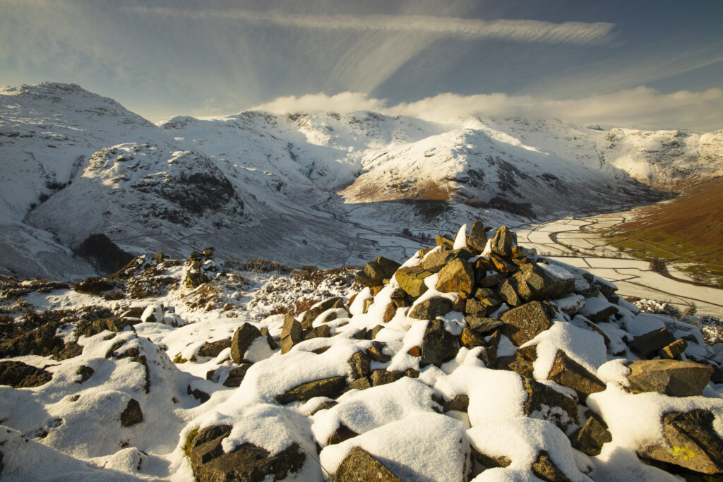 England, Cumbria, Lake District National Park. A snow covered Great Langdale Valley photographed on a mid winter day.