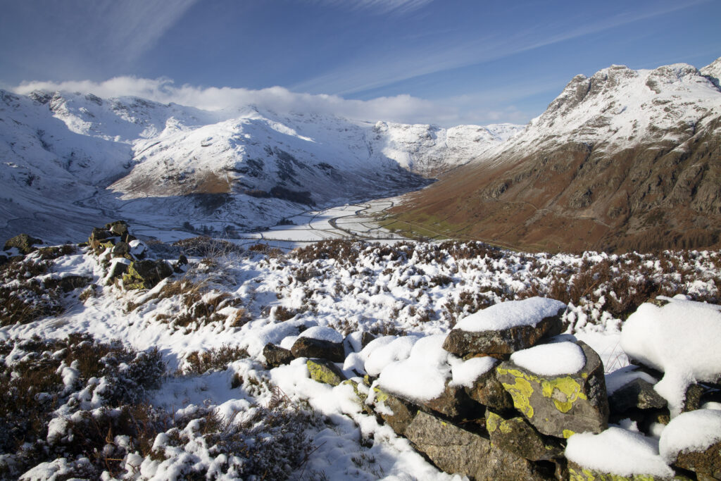 England, Cumbria, Lake District National Park. A snow covered Great Langdale Valley photographed on a mid winter day.