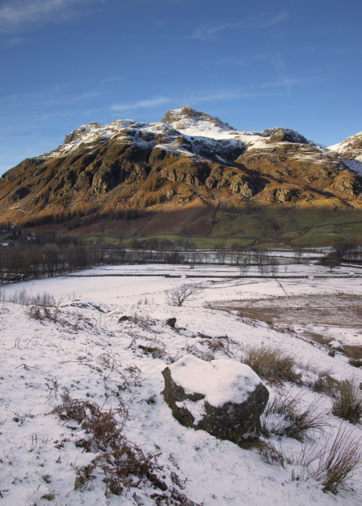 England, Cumbria, Lake District National Park. A snow covered Great Langdale Valley photographed on a mid winter day.