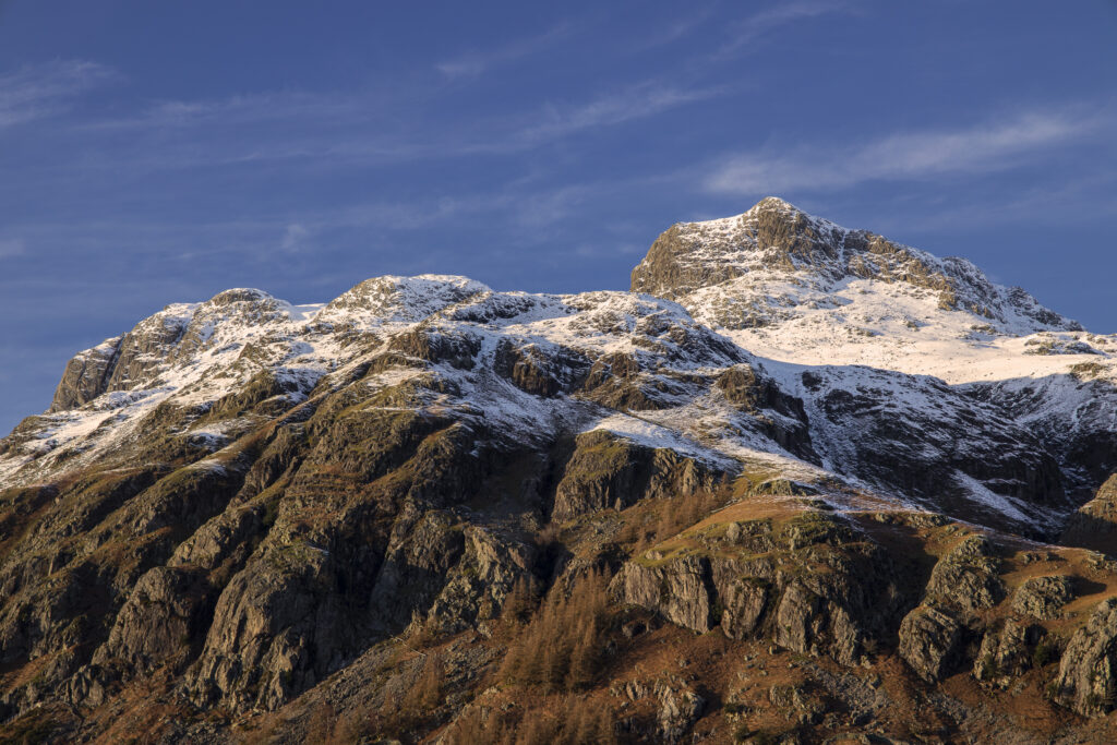 England, Cumbria, Lake District National Park. A snow covered Great Langdale Valley photographed on a mid winter day.