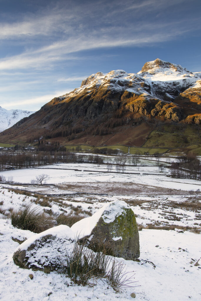 England, Cumbria, Lake District National Park. A snow covered Great Langdale Valley photographed on a mid winter day.
