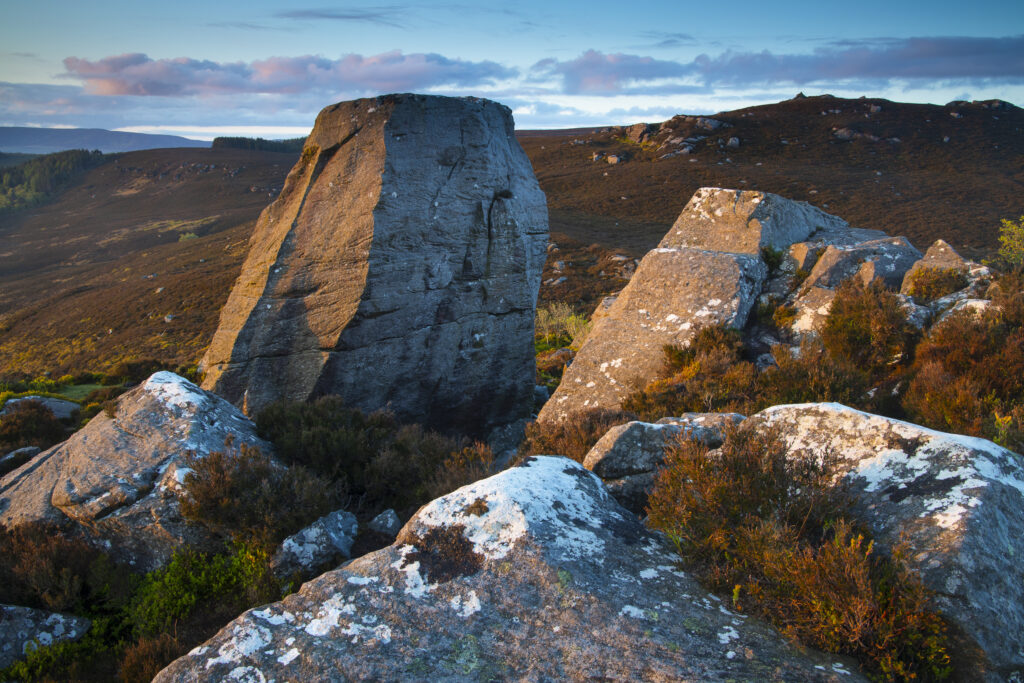 England, Northumberland, Northumberland National Park. The Drake Stone at dawn looking towards Harbottle.