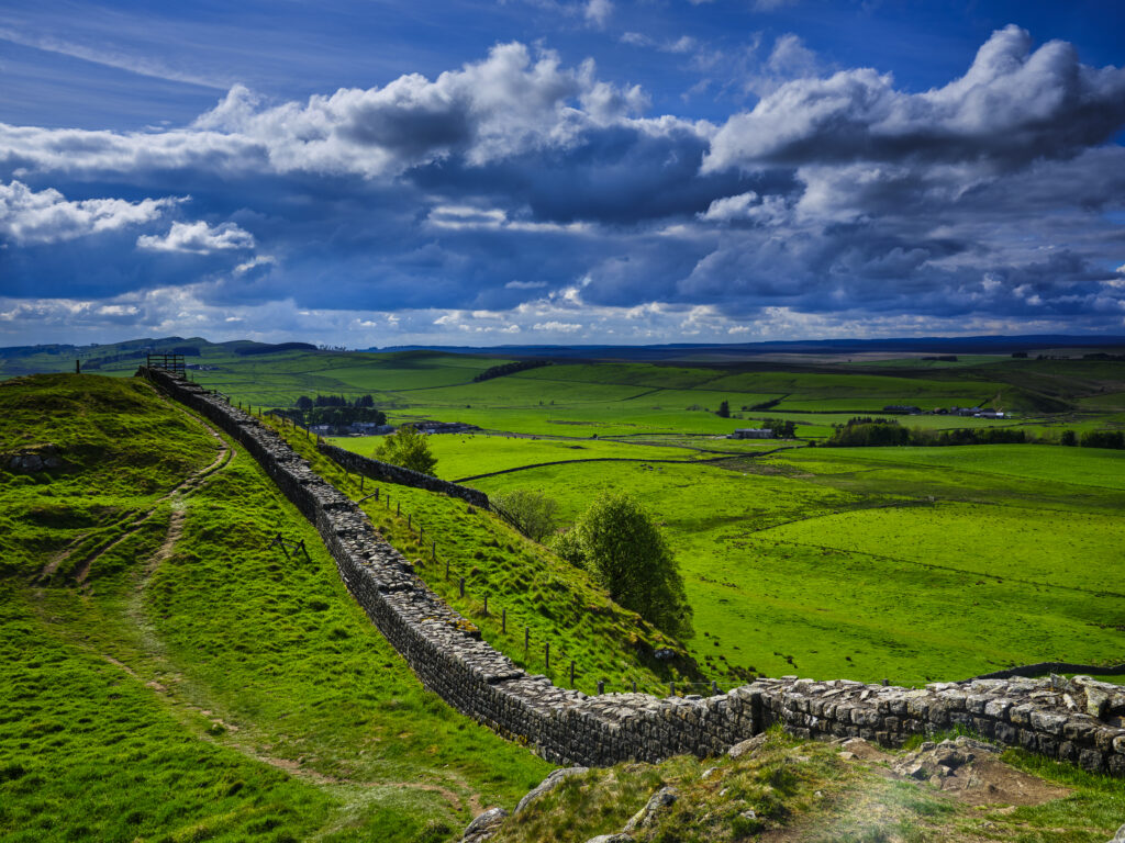England, Northumberland, Northumberland National Park. A well preserved stretch of Hadrian's Wall passing along Caw Gap.