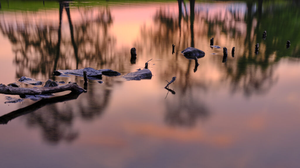 England, Cumbria, Lake District National Park. Sunset at Low Wray refelcted in the still waters of Lake Windermere near the town of Ambleside.