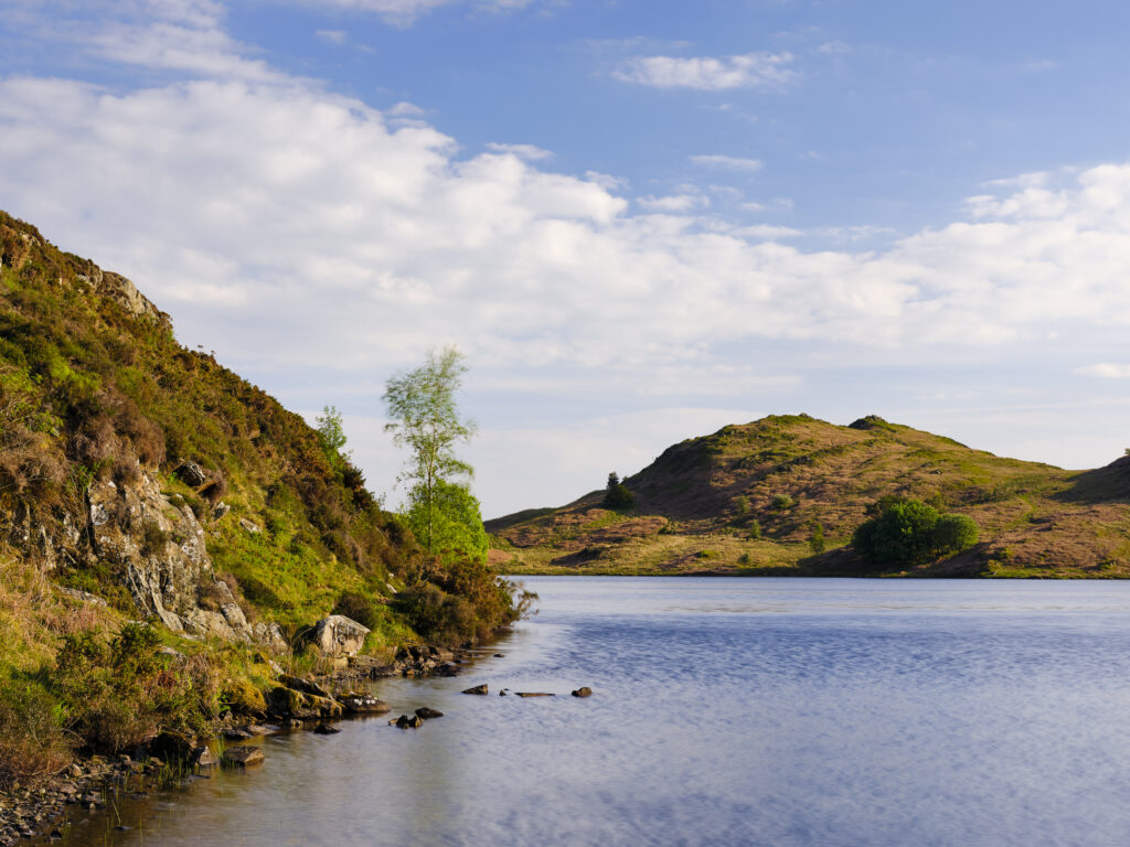 England, Cumbria, Lake District National Park. Beacon Tarn, located on Torver Common, a small lake found on the Cumbria Way long distance track.