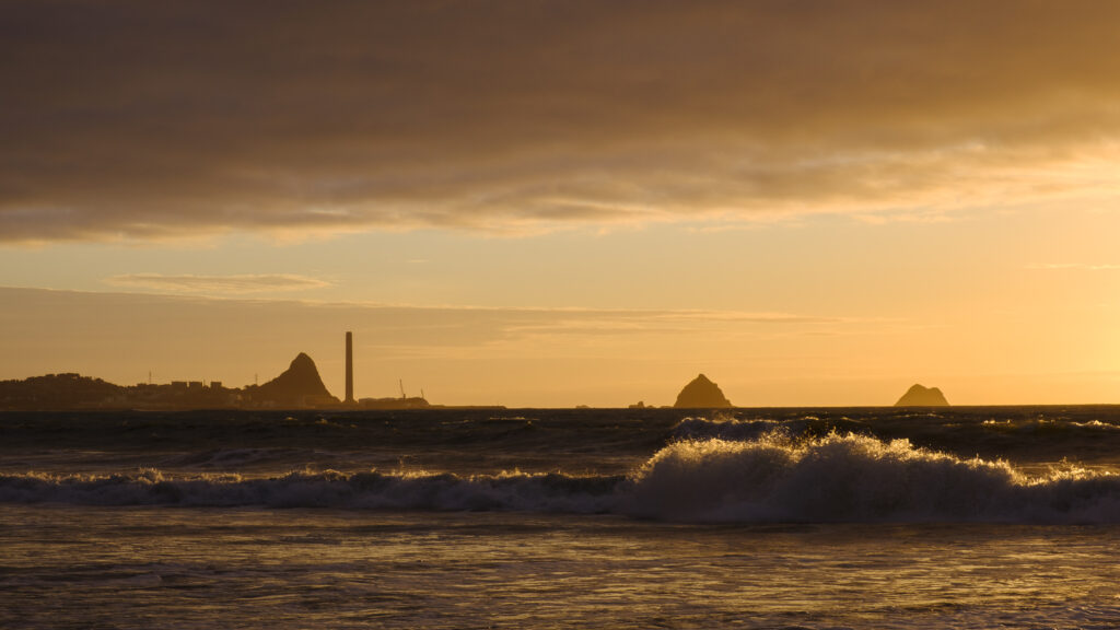 New Zealand, North Island, New Plymouth. Fitzroy Beach at sunset, a popular local beach near New Plymouth in the Taranaki region.