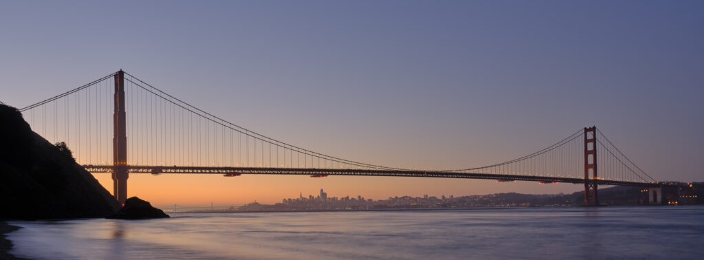 United States of America, California, Golden Gate Bridge. The iconic Golden Gate Bridge in San Francisco viewed from Kirby Cove at dawn.