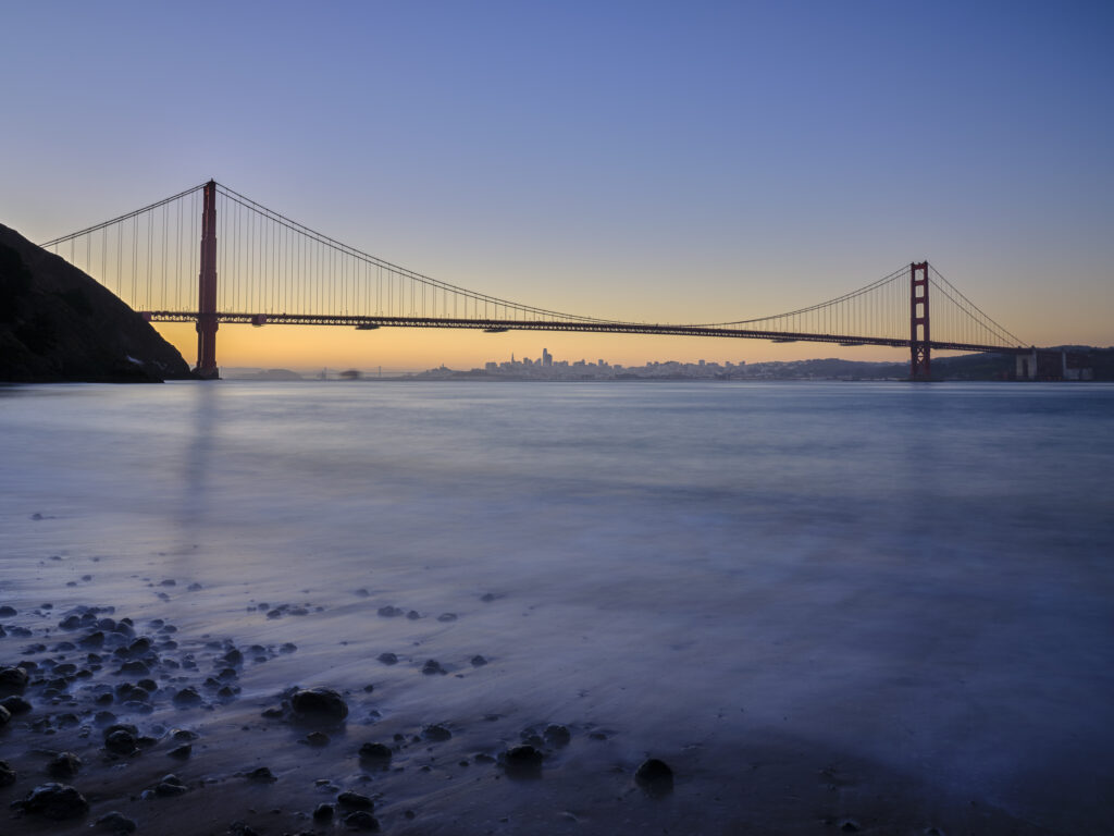 United States of America, California, Golden Gate Bridge. The iconic Golden Gate Bridge in San Francisco viewed from Kirby Cove at dawn.