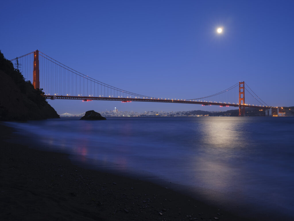 United States of America, California, Golden Gate Bridge. The iconic Golden Gate Bridge in San Francisco viewed from Kirby Cove at dusk.