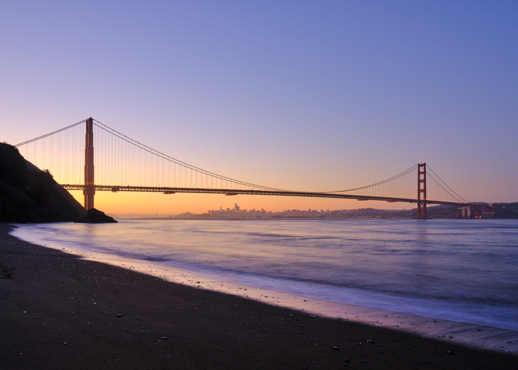 United States of America, California, Golden Gate Bridge. The iconic Golden Gate Bridge in San Francisco viewed from Kirby Cove at dawn.