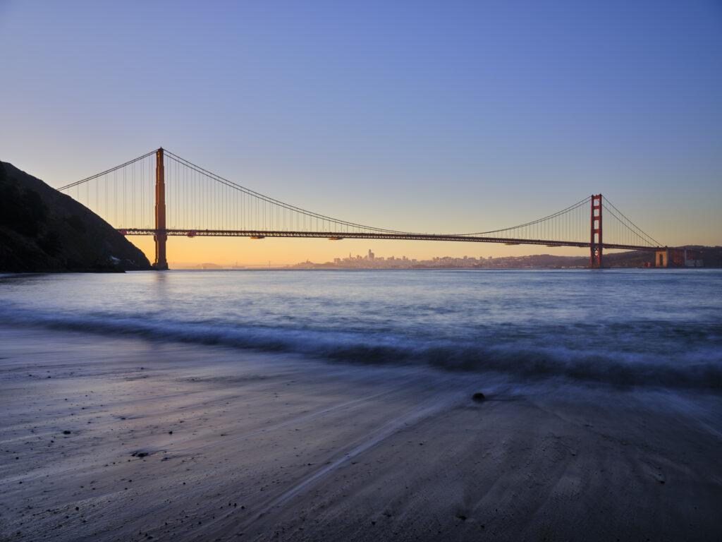 United States of America, California, Golden Gate Bridge. The iconic Golden Gate Bridge in San Francisco viewed from Kirby Cove at dawn.