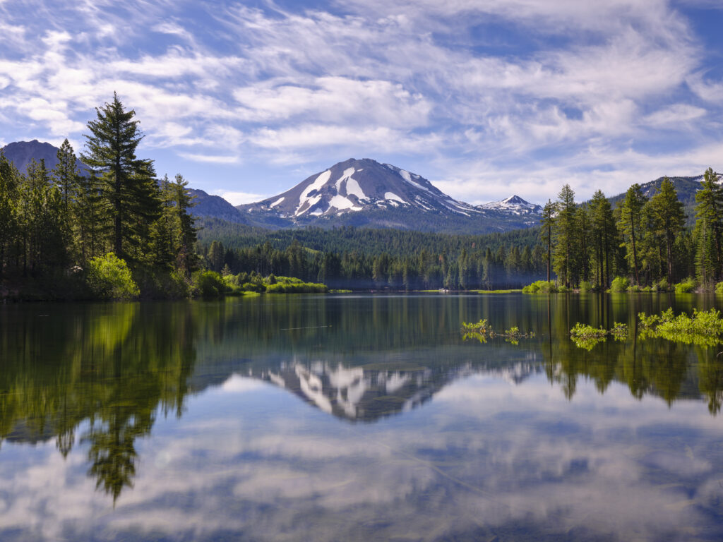 United States of America, California, Lassen Volcanic National Park. Lassen Peak reflected in the still waters of Manzanita Lake, located in the heart of the Lassen Volcanic National Park.
