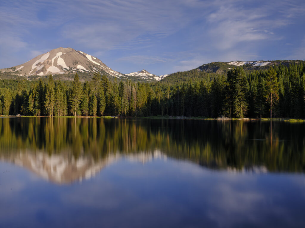 United States of America, California, Lassen Volcanic National Park. Lassen Peak reflected in the still waters of Manzanita Lake, located in the heart of the Lassen Volcanic National Park.