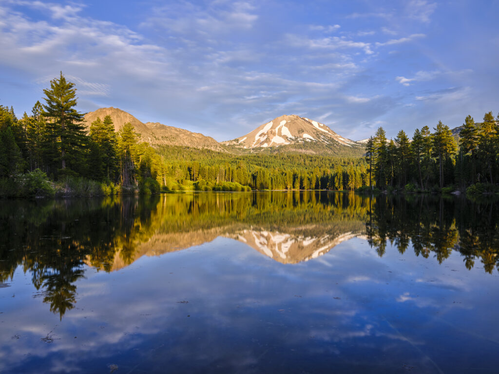 United States of America, California, Lassen Volcanic National Park. Lassen Peak reflected in the still waters of Manzanita Lake, located in the heart of the Lassen Volcanic National Park.