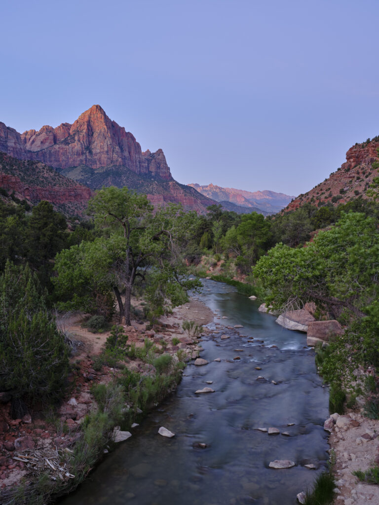 United States of America, Utah, Zion National Park. Dawn light hits the mountain known as 'The Watchman' in the Zion National Park.