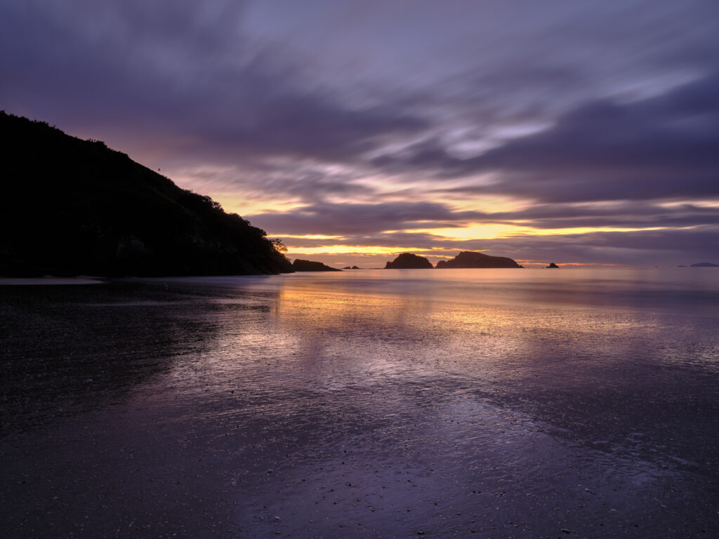 New Zealand, North Island, Matauri Bay. The picturesque Matauri Bay, near the Cavalli Islands - The final resting place of the Greenpeace Rainbow Warrior ship.