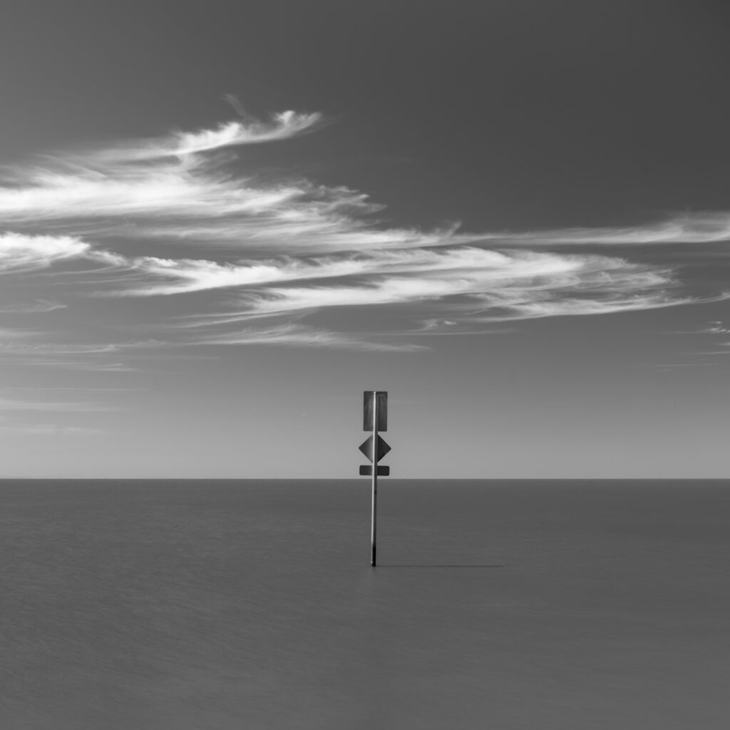 Australia, Southern Australia, Narrung Jetty Reserve. Submerged sign near the Narrung Jetty and the Lake Alexandrina Narrows.