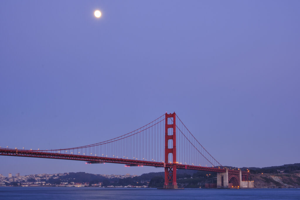 United States of America, California, Golden Gate Bridge. The iconic Golden Gate Bridge in San Francisco viewed from Kirby Cove at dusk.
