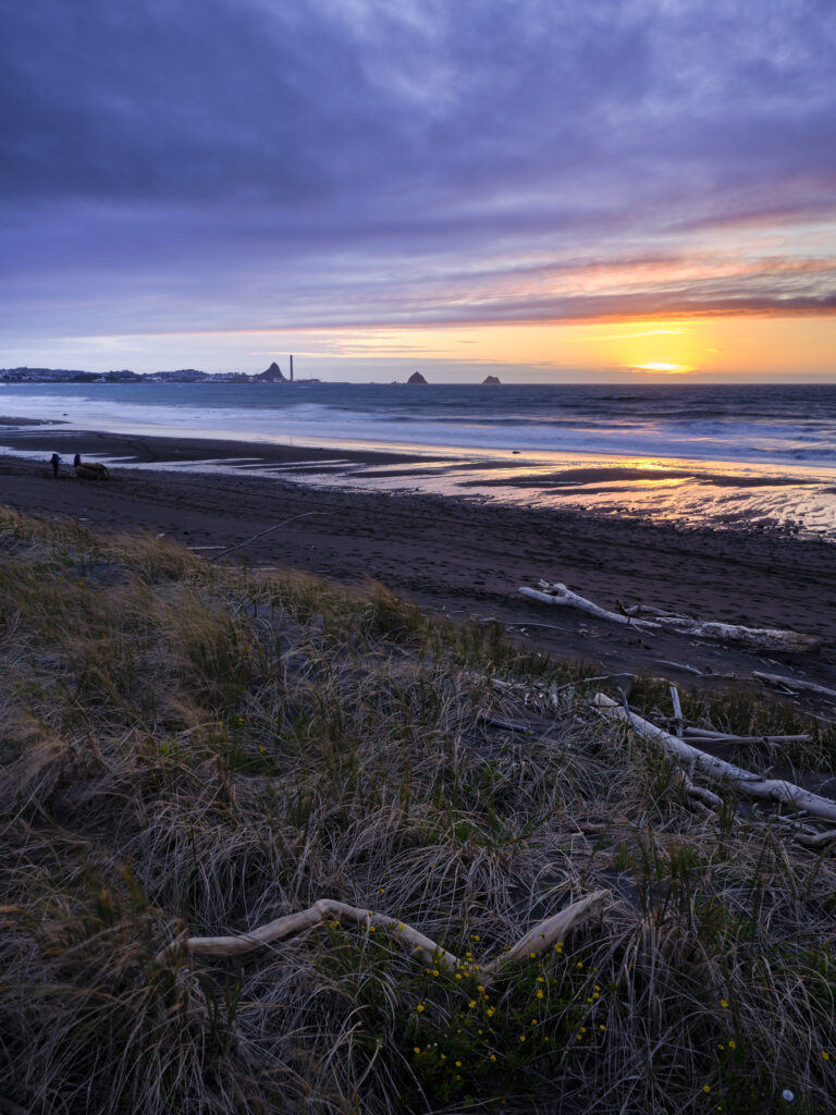 New Zealand, North Island, New Plymouth. Fitzroy Beach at sunset, a popular local beach near New Plymouth in the Taranaki region.