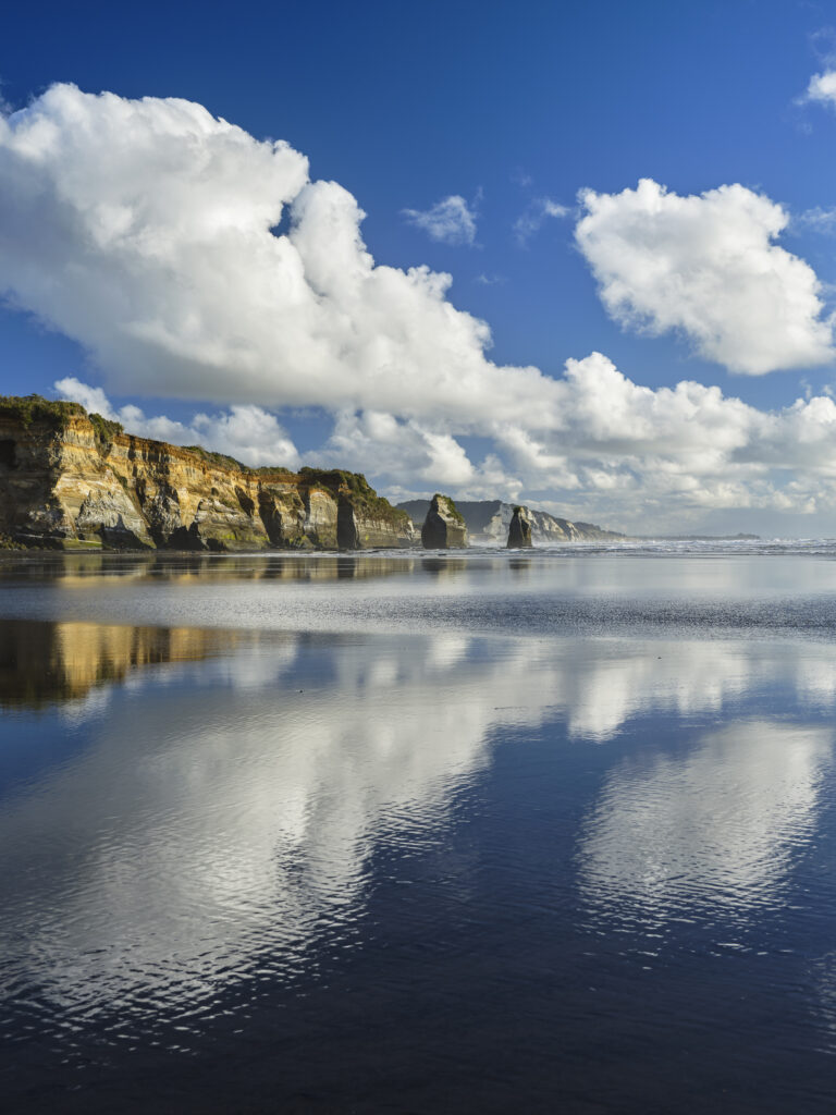 New Zealand, North Island, Three Sisters. The unique rock formations known as the Three Sisters and The Elephant, located on the North Taranaki Coast near Tongaporutu.