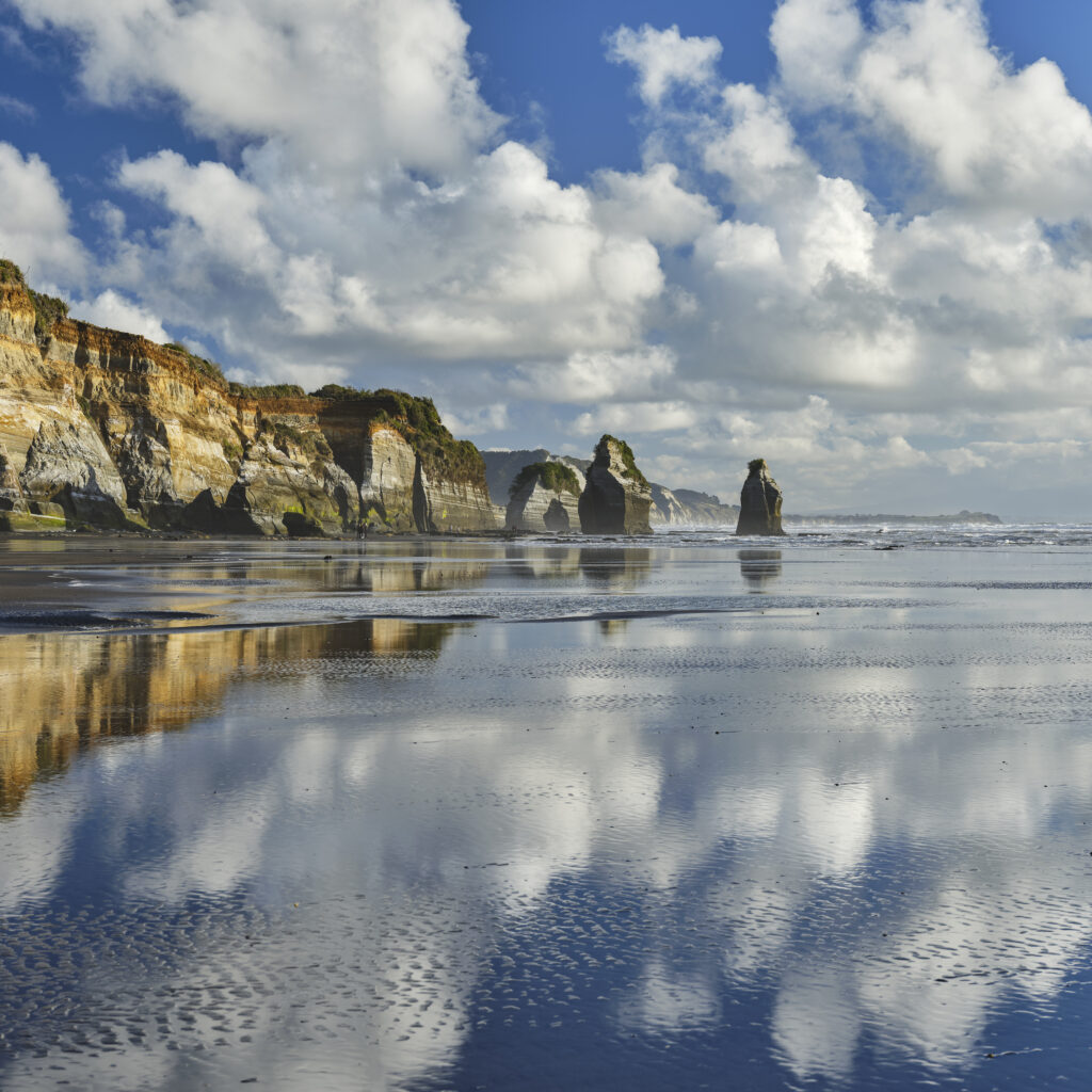 New Zealand, North Island, Three Sisters. The unique rock formations known as the Three Sisters and The Elephant, located on the North Taranaki Coast near Tongaporutu.