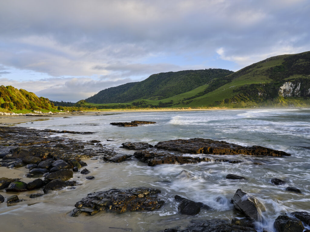 New Zealand, Southland, The Catlins. Early morning at Purakaunui Bay, a popular camping spot along the Catlins Coast.