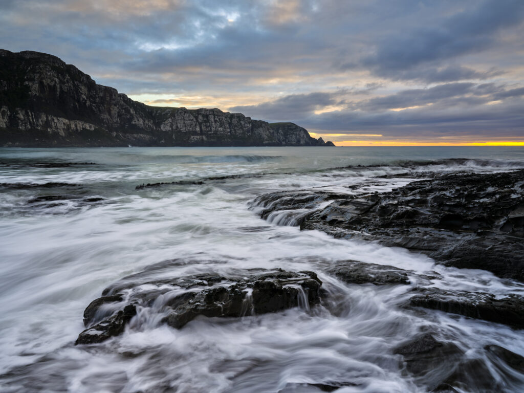 New Zealand, Southland, The Catlins. Early morning at Purakaunui Bay, a popular camping spot along the Catlins Coast.