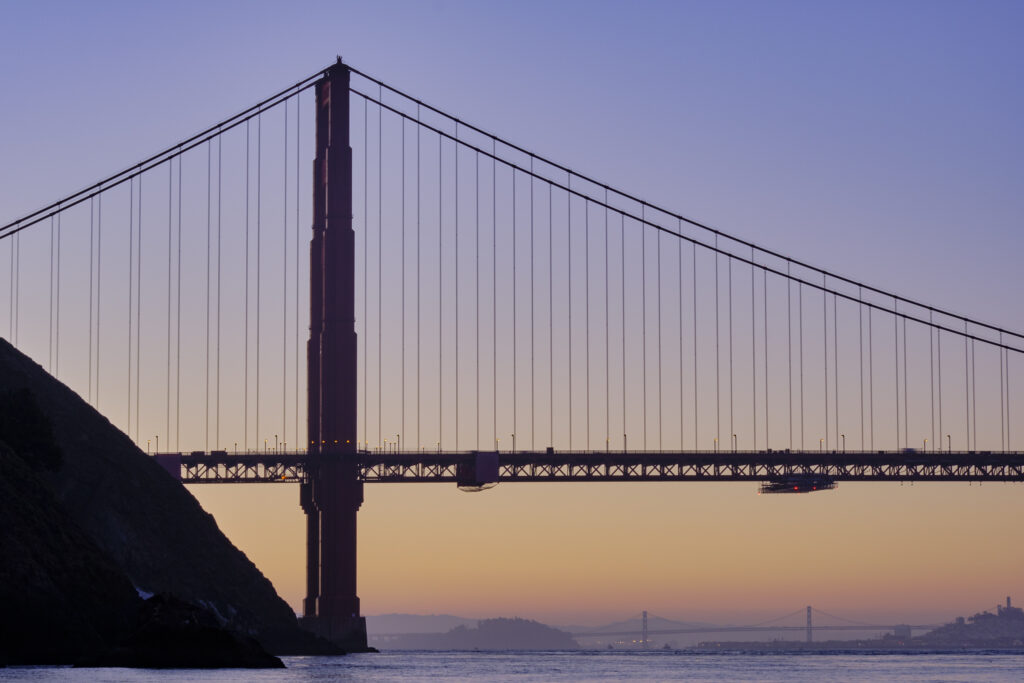 United States of America, California, Golden Gate Bridge. The iconic Golden Gate Bridge in San Francisco viewed from Kirby Cove at dawn.