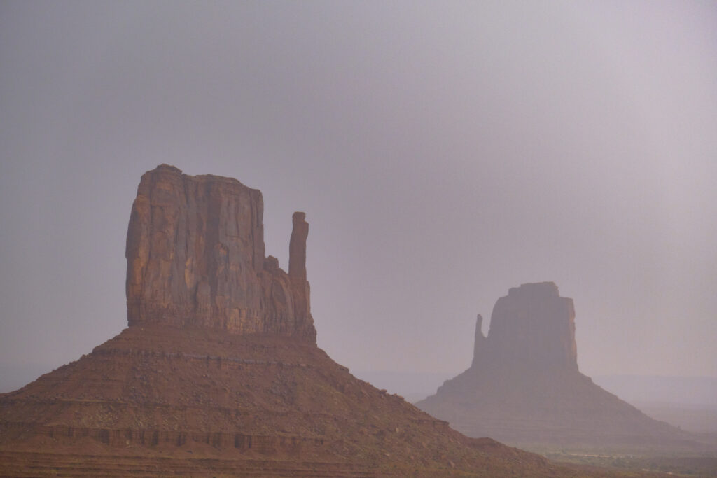 United States of America, Arizona, Monument Valley Tribal Park. The iconic landscape of the sandstone buttes of the Monument Valley Tribal Park located in the Navajo Nation straddling the Arizona / Utah border.