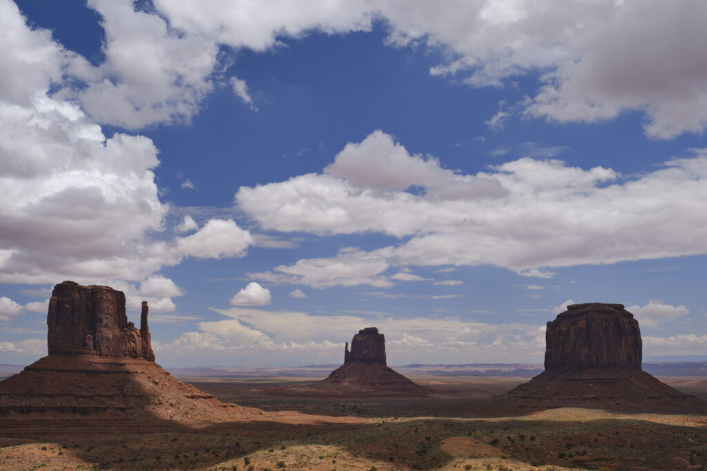 United States of America, Arizona, Monument Valley Tribal Park. The iconic landscape of the sandstone buttes of the Monument Valley Tribal Park located in the Navajo Nation straddling the Arizona / Utah border.