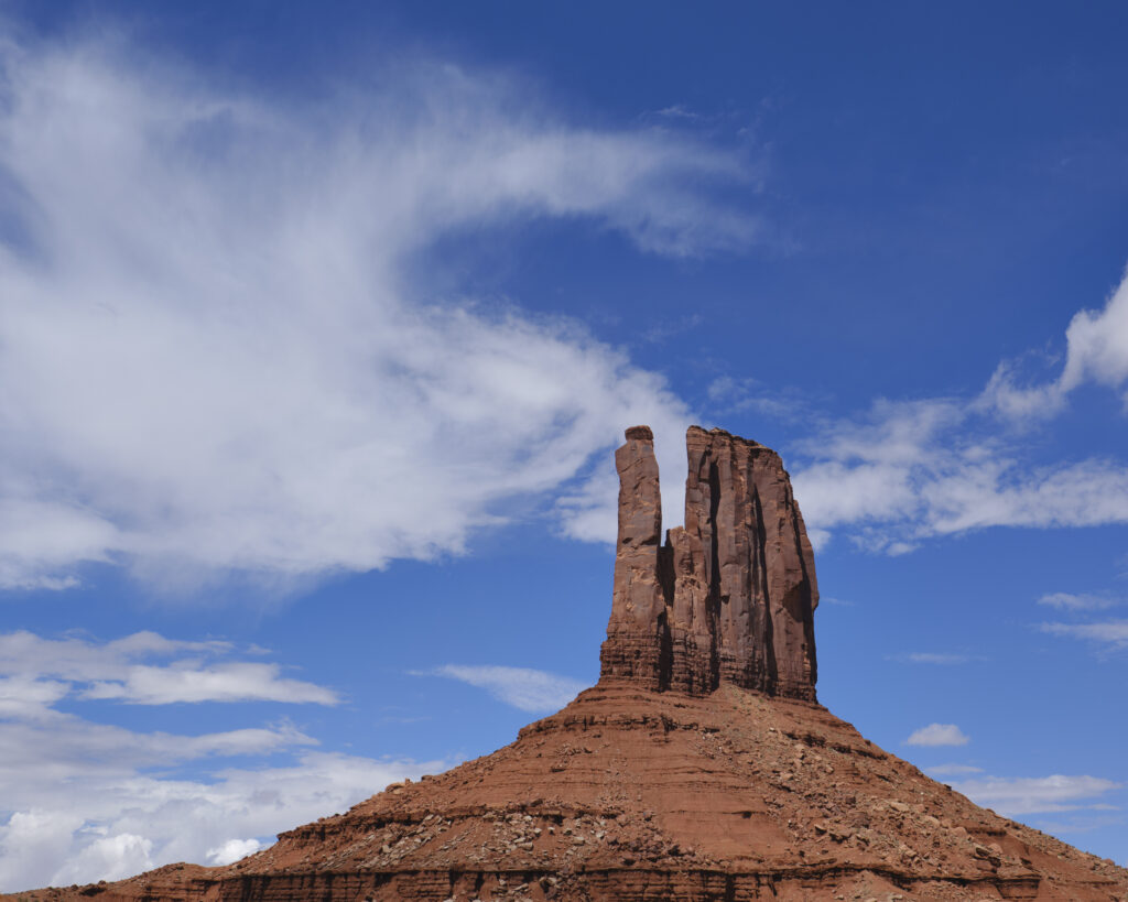 United States of America, Arizona, Monument Valley Tribal Park. The iconic landscape of the sandstone buttes of the Monument Valley Tribal Park located in the Navajo Nation straddling the Arizona / Utah border.