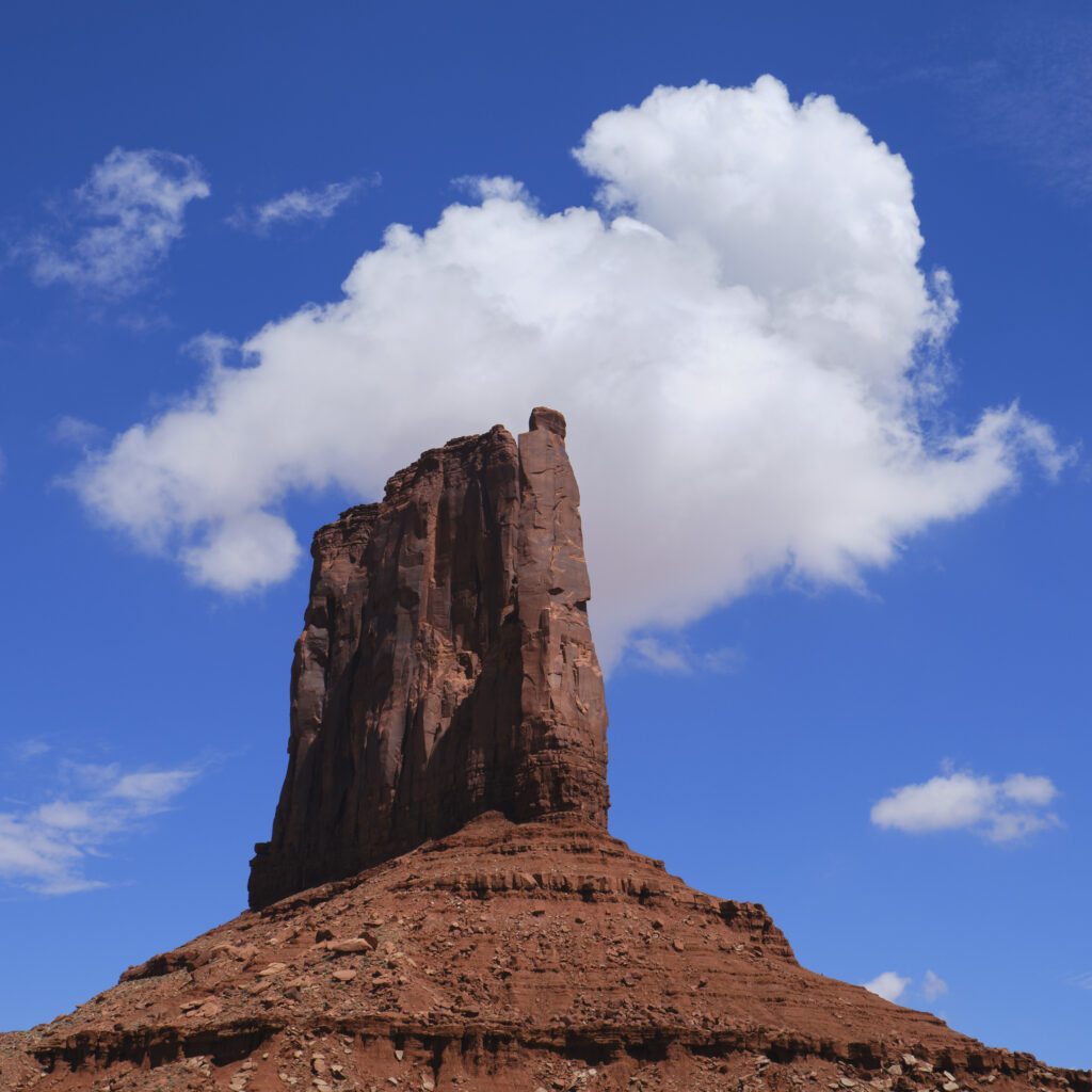 United States of America, Arizona, Monument Valley Tribal Park. The iconic landscape of the sandstone buttes of the Monument Valley Tribal Park located in the Navajo Nation straddling the Arizona / Utah border.