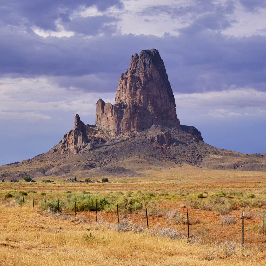 United States of America, Arizona, Monument Valley Tribal Park. The iconic landscape of the sandstone buttes of the Monument Valley Tribal Park located in the Navajo Nation straddling the Arizona / Utah border.