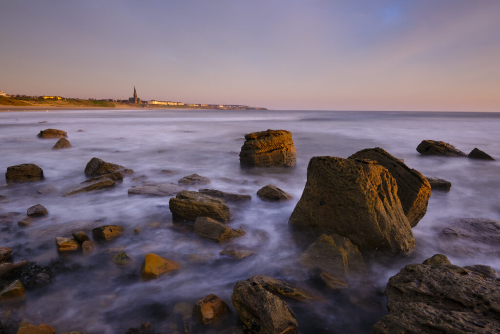 England, Tyne and Wear, Tynemouth. Looking north from Sharpness Point towards Cullercoats and Tynemouth Long Sands.