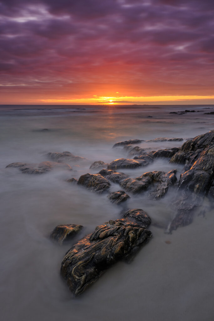 Scotland, Isle of North Uist, Traigh Stir. Sunset at Traigh Stir beach, near Hosta on the Isle of North Uist.