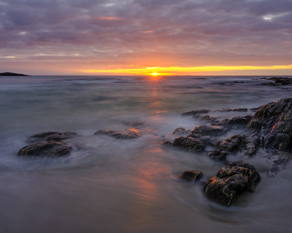 Scotland, Isle of North Uist, Traigh Stir. Sunset at Traigh Stir beach, near Hosta on the Isle of North Uist.