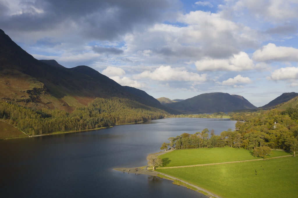 England, Cumbria, Lake District National Park. Aerial view of Buttermere lake looking towards Crummock Water shortly after sunrise on an autumn day.